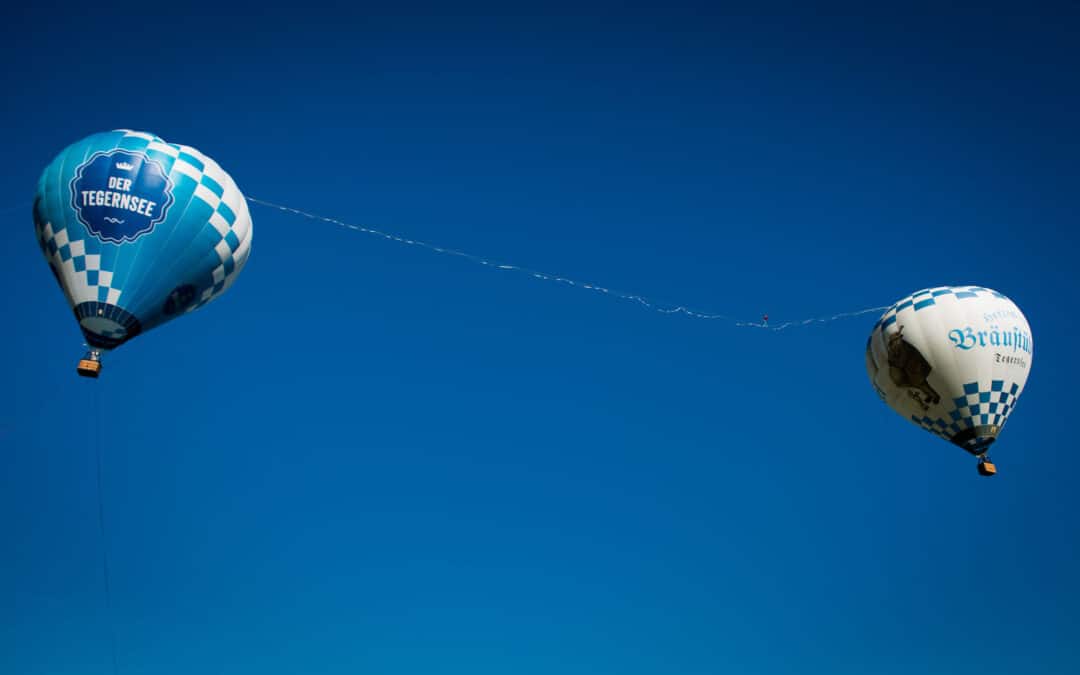 „Vom Bräustüberl auf den Tegernsee“ – Die weltweit längste Highline zwischen Heißluftballons