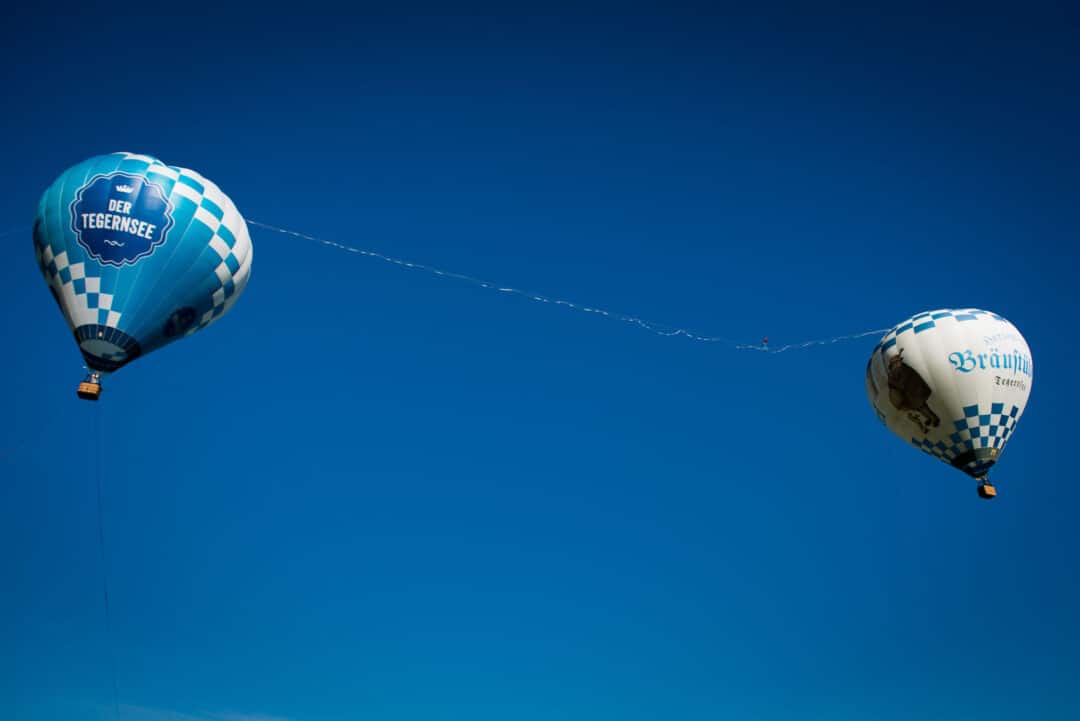 „Vom Bräustüberl auf den Tegernsee“ – Die weltweit längste Highline zwischen Heißluftballons